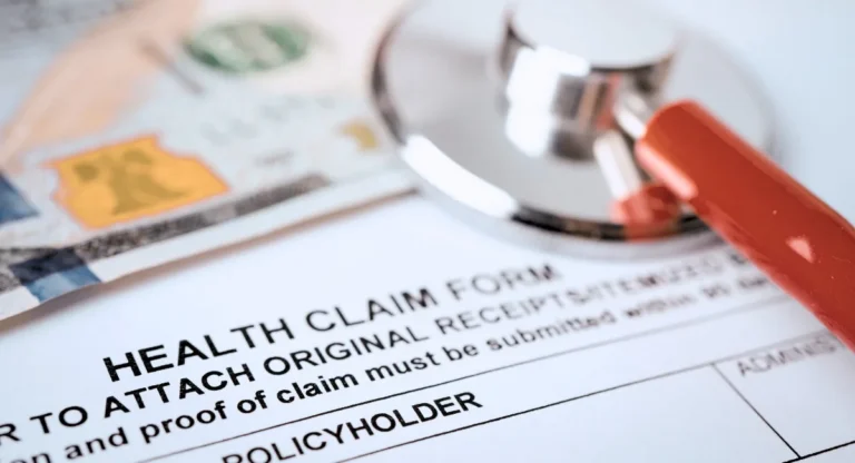 image of a health claim form with a stethoscope placed on top of it